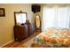 Bedroom showcasing hardwood floors, traditional furnishings, and a well-lit window at 311 Kelsey Way # 3, Sun City Center, FL 33573