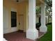 Charming front entrance with brick flooring and covered porch at 311 Kelsey Way # 3, Sun City Center, FL 33573