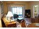 Cozy living room with sliding glass doors to outdoor patio at 311 Kelsey Way # 3, Sun City Center, FL 33573