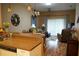 Open concept living space seamlessly connects kitchen and dining areas, perfect for entertaining at 311 Kelsey Way # 3, Sun City Center, FL 33573