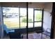 Relaxing screened patio with comfortable seating, offering a pleasant outdoor living space with scenic views at 311 Kelsey Way # 3, Sun City Center, FL 33573