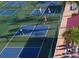 Aerial view of residents enjoying a game of pickleball on a well-maintained court at 311 Kelsey Way # 3, Sun City Center, FL 33573