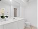 Bright bathroom featuring a white vanity, large mirror, and tiled floor at 3702 54Th W Dr # 104, Bradenton, FL 34210