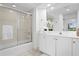 Bright bathroom featuring a shower over tub, white cabinets, and tile flooring at 3702 54Th W Dr # 104, Bradenton, FL 34210