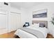 Bedroom features a large closet, hardwood floors, and a comfortable bed at 3702 54Th W Dr # 104, Bradenton, FL 34210