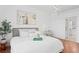 Serene bedroom with a comfortable bed, stylish decor, and a bathroom entrance for added privacy at 3702 54Th W Dr # 104, Bradenton, FL 34210
