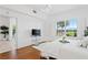 Well-lit bedroom featuring wood floors and a window view to the green landscape at 3702 54Th W Dr # 104, Bradenton, FL 34210
