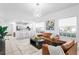 Inviting living room featuring a sleek leather sofa, open to the kitchen bar for easy entertaining at 3702 54Th W Dr # 104, Bradenton, FL 34210
