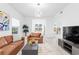 Open living space featuring a tan leather sofa and contemporary design elements at 3702 54Th W Dr # 104, Bradenton, FL 34210
