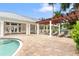 Inviting pool area with covered seating, perfect for lounging and enjoying the beautiful surroundings at 3702 54Th W Dr # 104, Bradenton, FL 34210