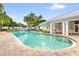 Refreshing community pool with sun loungers surrounded by beautiful landscaping at 3702 54Th W Dr # 104, Bradenton, FL 34210