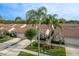This property features lush landscaping, a tile roof, and an attached two-car garage at 3875 Darston St, Palm Harbor, FL 34685