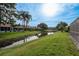 Enjoy the green backyard of this home, which also offers a view of the community waterway at 3875 Darston St, Palm Harbor, FL 34685