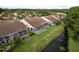Lovely backyard featuring a screened lanai with a pond view at 3875 Darston St, Palm Harbor, FL 34685