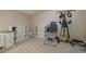 Spacious basement area with neutral carpet and storage shelves with exercise equipment at 3875 Darston St, Palm Harbor, FL 34685