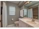Traditional bathroom with a vanity sink, mirrored medicine cabinet, and a shower featuring a curtain and handrails at 3875 Darston St, Palm Harbor, FL 34685