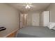 Bedroom features include light-colored walls, ceiling fan, and closet space with mirrored door at 3875 Darston St, Palm Harbor, FL 34685