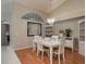 Elegant dining room with modern lighting and beautiful architectural features, great for hosting at 3875 Darston St, Palm Harbor, FL 34685