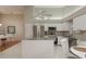 Well-equipped kitchen with stainless steel appliances and granite island, perfect for culinary enthusiasts at 3875 Darston St, Palm Harbor, FL 34685