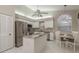 Spacious kitchen with stainless steel appliances and a cozy breakfast nook, a central hub at 3875 Darston St, Palm Harbor, FL 34685