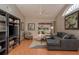 Inviting living room features a plush sectional sofa, modern decor, and a sliding glass door with backyard views at 3875 Darston St, Palm Harbor, FL 34685