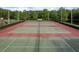Enjoy the community tennis courts for recreation and exercise, surrounded by lush greenery at 3875 Darston St, Palm Harbor, FL 34685