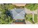 Aerial view showcasing house roof, swimming pool, driveway, and landscaping at 3903 W De Leon St, Tampa, FL 33609