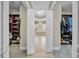 View from dual walk-in closets towards the luxurious bathroom at 3903 W De Leon St, Tampa, FL 33609