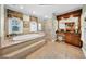 Bright bathroom with soaking tub, separate shower, and vanities at 3903 W De Leon St, Tampa, FL 33609