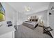 Cozy bedroom features a ceiling fan, neutral paint, plush carpet, and natural light at 3903 W De Leon St, Tampa, FL 33609