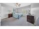 Comfortable bedroom features a ceiling fan, plantation shutters, plush carpet, and cool paint tones at 3903 W De Leon St, Tampa, FL 33609