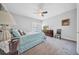 Comfortable bedroom features a ceiling fan, plantation shutters, plush carpet, and cool paint tones at 3903 W De Leon St, Tampa, FL 33609