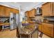 Well-equipped kitchen features granite countertops, stainless steel appliances, and a functional island at 3903 W De Leon St, Tampa, FL 33609