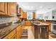 Spacious kitchen featuring stainless steel appliances, an island, and granite countertops at 3903 W De Leon St, Tampa, FL 33609