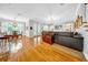 Open-concept living room with hardwood floors, decorative lighting, and plenty of natural light at 3903 W De Leon St, Tampa, FL 33609