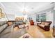 Bright living room showcasing a modern sofa, decorative lighting, and access to outdoor views at 3903 W De Leon St, Tampa, FL 33609