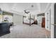 Main bedroom suite with tray ceilings, sitting area, and natural light at 3903 W De Leon St, Tampa, FL 33609