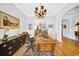 Inviting office with hardwood floors, a wooden desk, and views to the dining room at 3903 W De Leon St, Tampa, FL 33609
