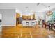 Spacious open floorplan, seamlessly integrates the kitchen and dining areas with hardwood floors at 3903 W De Leon St, Tampa, FL 33609