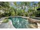 Backyard oasis showcasing a private pool, spa, and lush tropical landscape, perfect for outdoor enjoyment at 3903 W De Leon St, Tampa, FL 33609