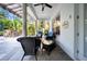 Charming porch with comfortable seating, ceiling fan, and lush greenery, ideal for relaxation at 3903 W De Leon St, Tampa, FL 33609