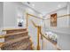 Elegant staircase with carpeted steps, white banister, and natural wood accents, leading to an upper floor at 3903 W De Leon St, Tampa, FL 33609
