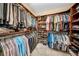 Organized walk-in closet with shelves and hanging rods at 3903 W De Leon St, Tampa, FL 33609