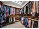 Custom walk-in closet with built-in storage and organized hanging racks at 3903 W De Leon St, Tampa, FL 33609