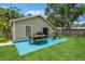 A backyard offering a patio with outdoor dining and green grass at 4021 Vana Dr, Sarasota, FL 34241