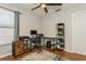 Bedroom featuring desk area, ceiling fan, and wood-look flooring at 4021 Vana Dr, Sarasota, FL 34241