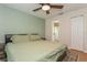 This spacious bedroom features a ceiling fan, neutral decor, and wood floors at 4021 Vana Dr, Sarasota, FL 34241
