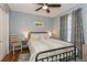 Cozy bedroom featuring a ceiling fan, soft lighting, and a comfortable queen-size bed at 4021 Vana Dr, Sarasota, FL 34241