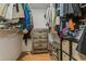 Organized walk-in closet with shelving, hanging space, drawers, and a shoe rack at 4021 Vana Dr, Sarasota, FL 34241