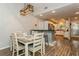 Inviting dining area features modern light fixture, bar seating, and an open-concept kitchen beyond at 4021 Vana Dr, Sarasota, FL 34241